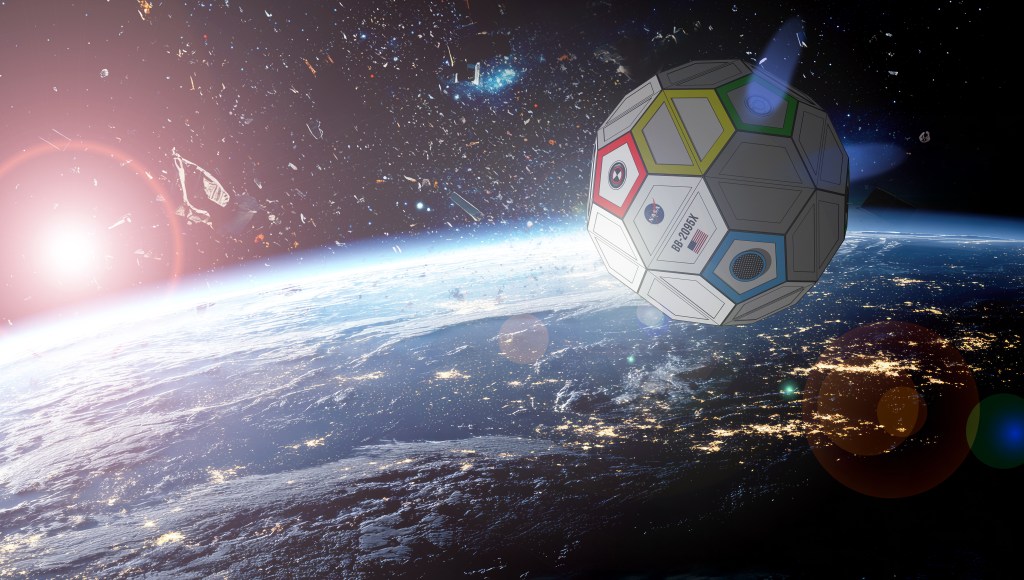 The image shows a soccer ball-shaped space ship absorbing debris in low-Earth orbit